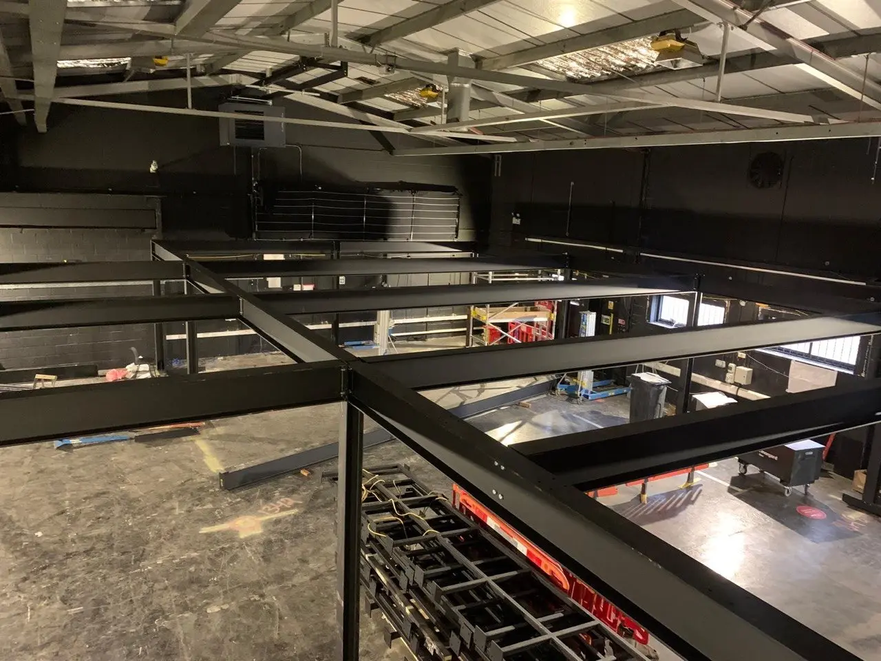 ANS Structural steelwork installed on a mezzanine floor, black RSJ beams and columns