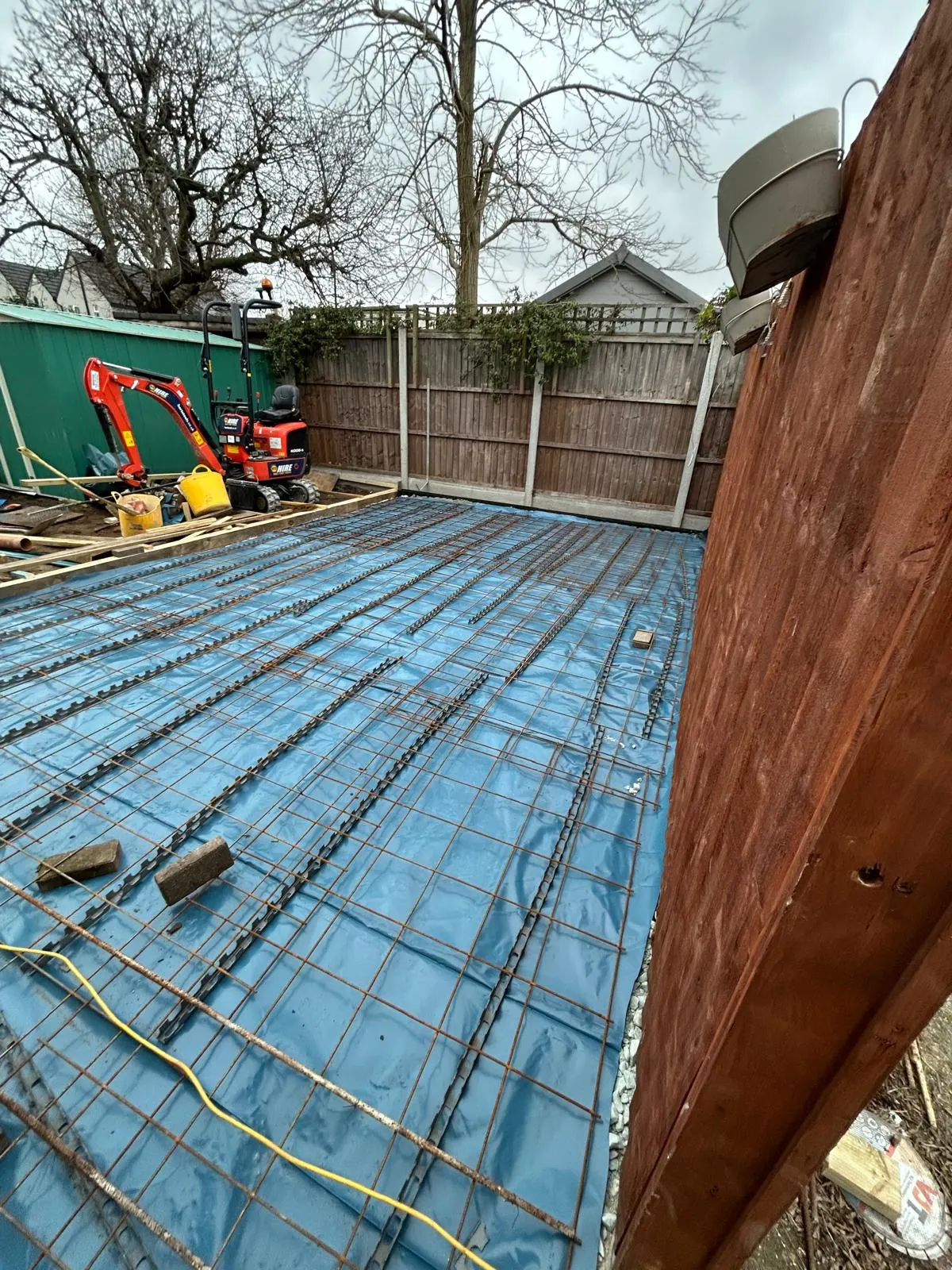Steel reinforcement mesh laid over a damp-proof membrane ready for a concrete slab