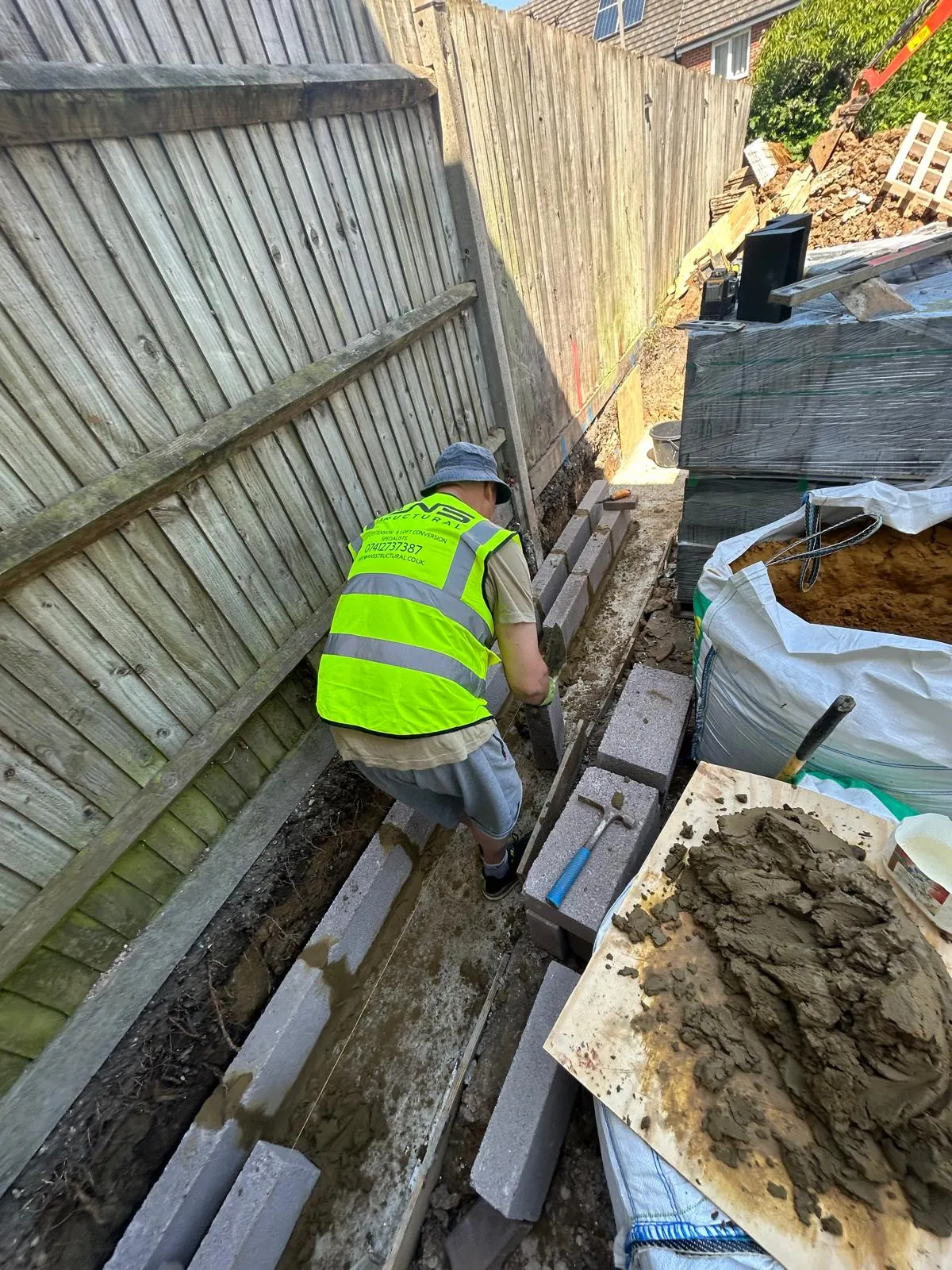 ANS Structural bricklayer running foundation blockwork to a string line