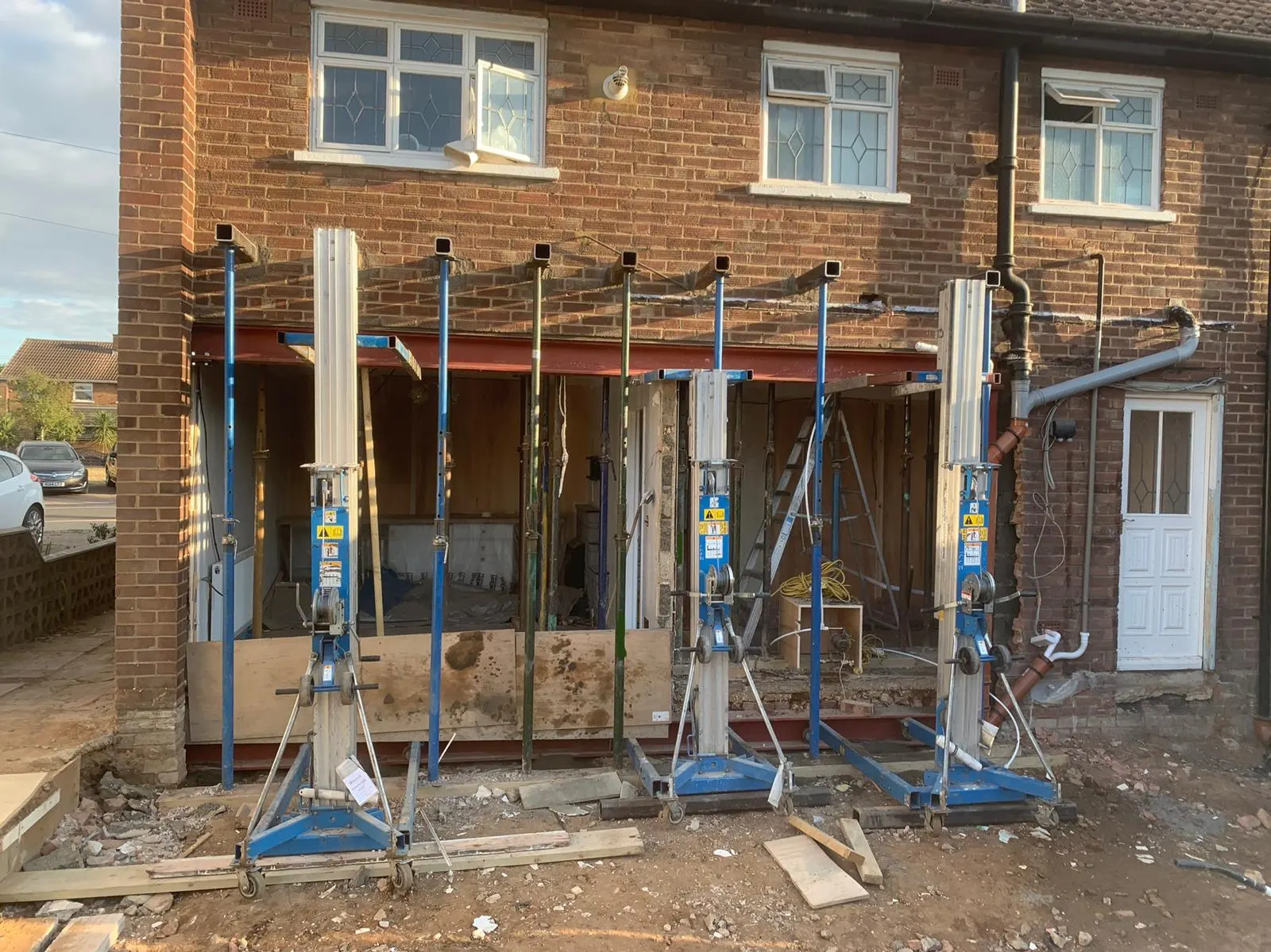 Structural steels installed across a new rear opening with temporary props still in place