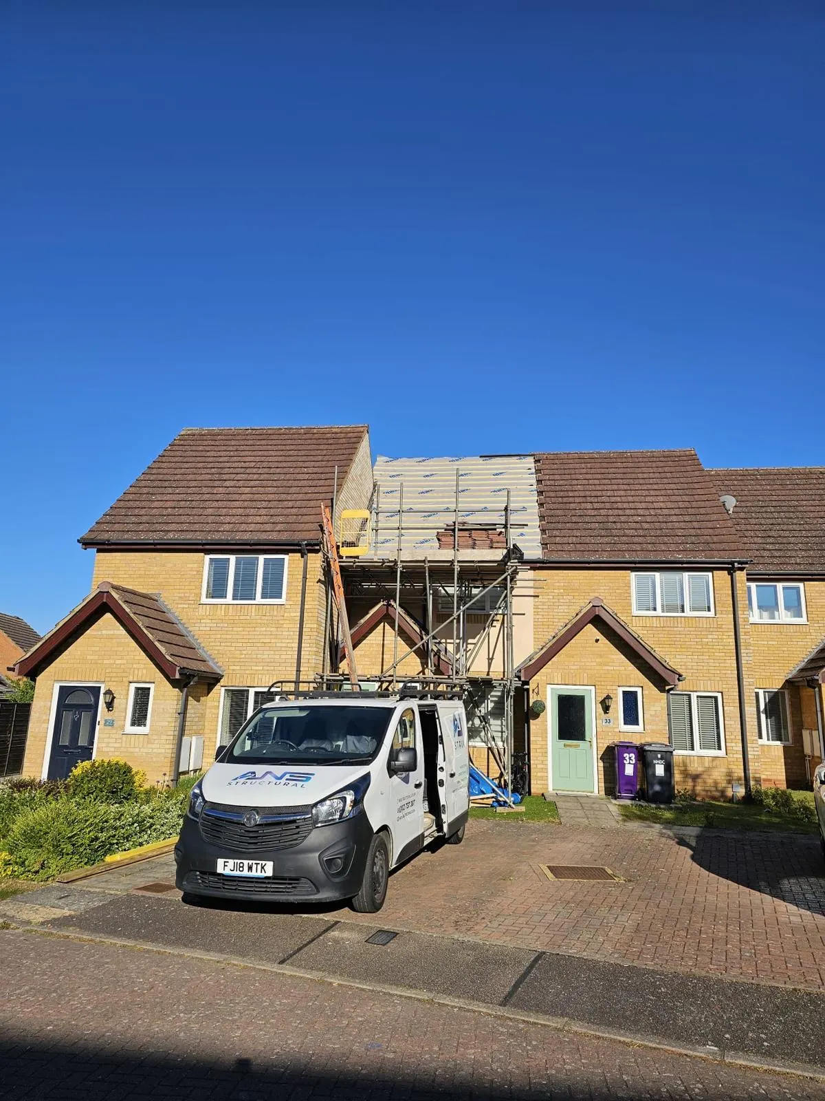 ANS Structural van and scaffolding outside a loft conversion re-roof in progress